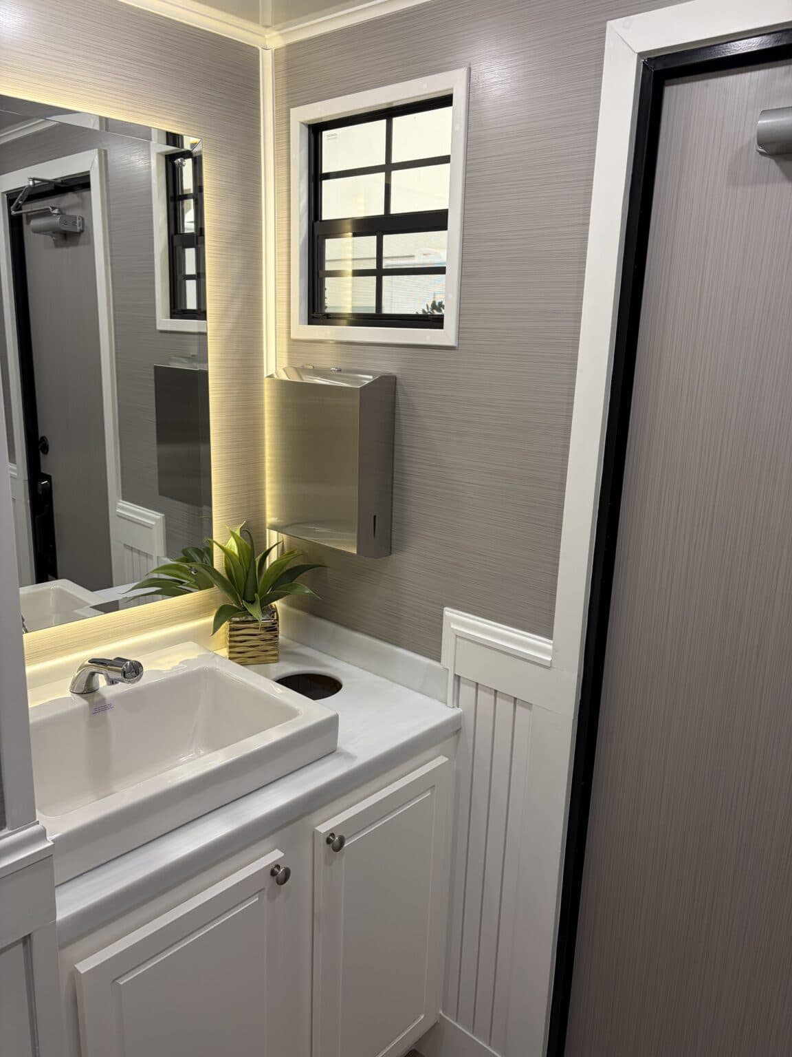 The Cottage interior vanity with backlit mirror